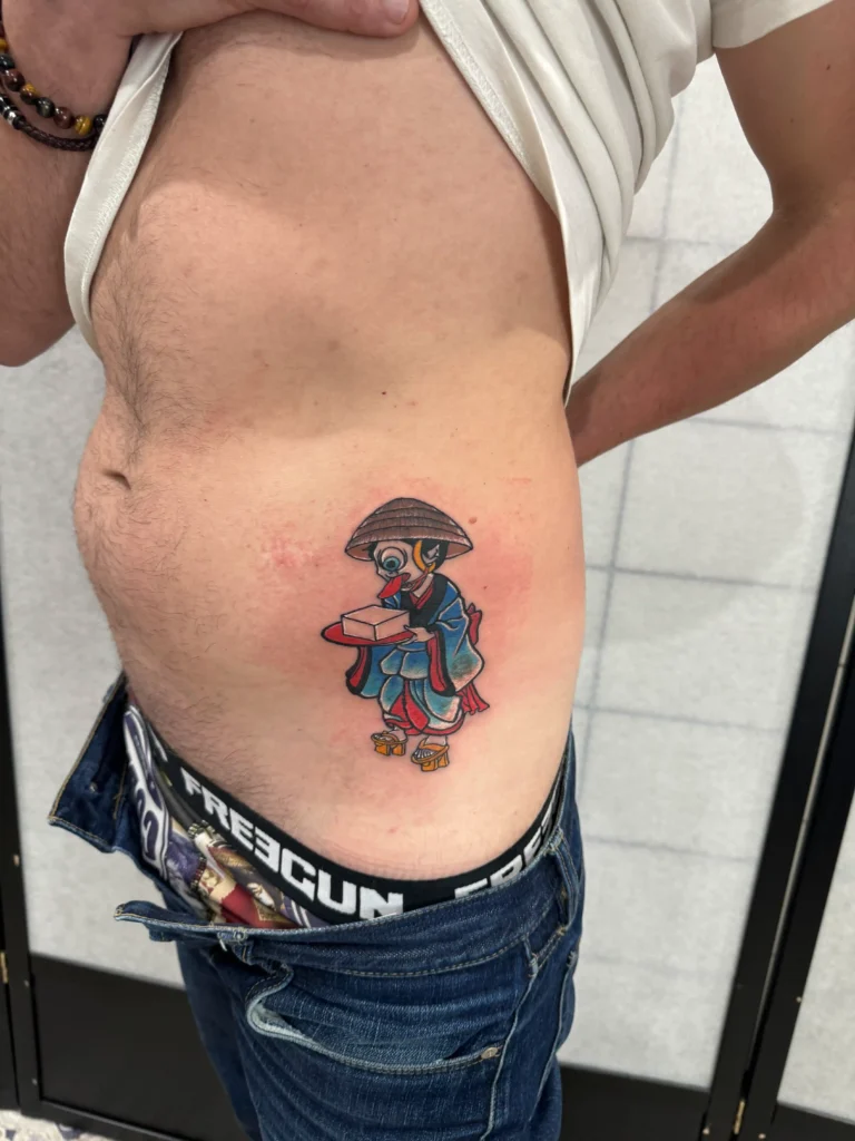 Colorful Japanese tattoo of Tofu-kozo (tofu boy), done in Tokyo by Mangesh Rane – whimsical traditional folklore character design | TATTOOINTOKYO